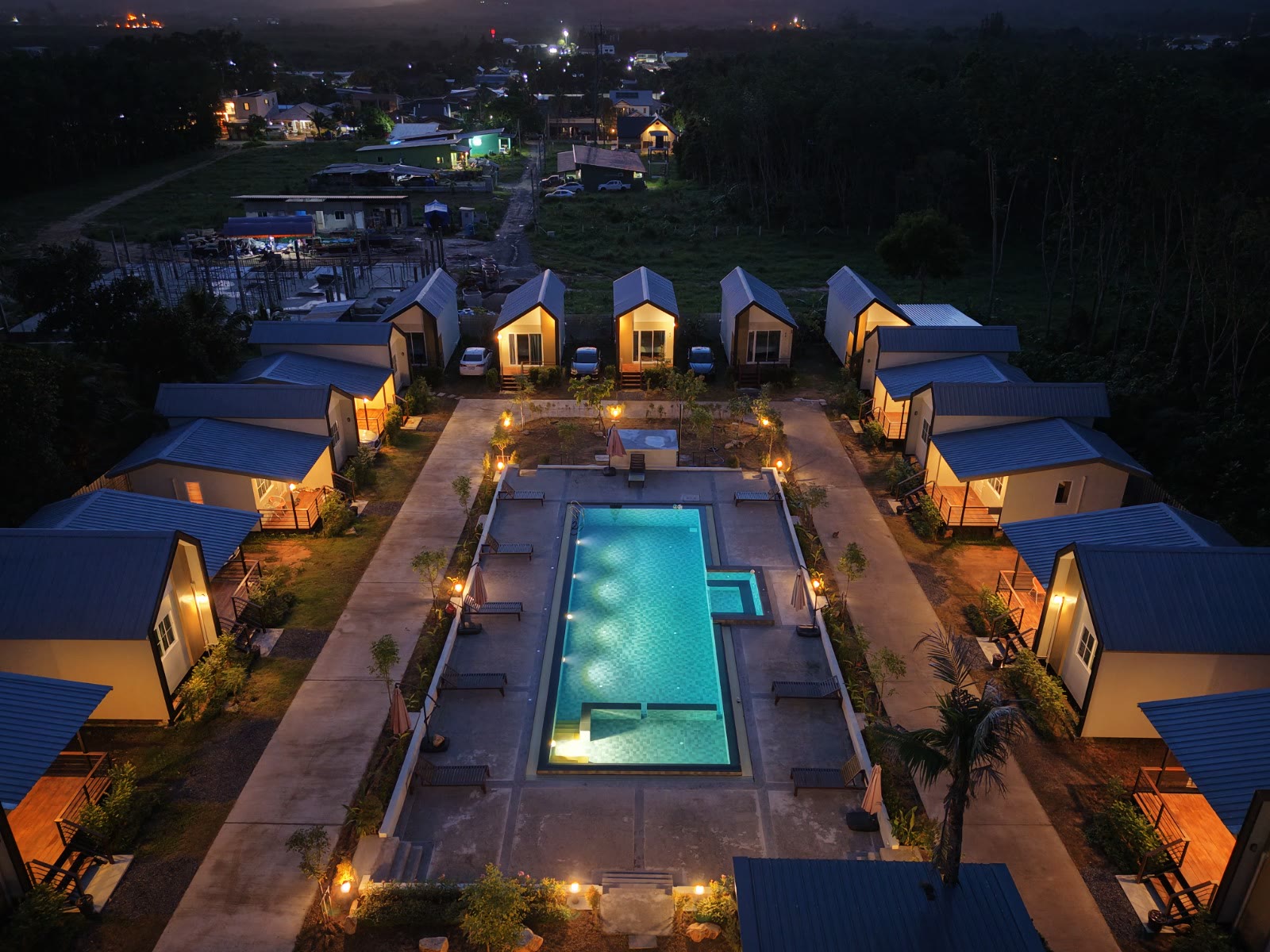 Aerial view of NaraRin Resort near Phuket Airport — cabins and pool at dusk in Thalang