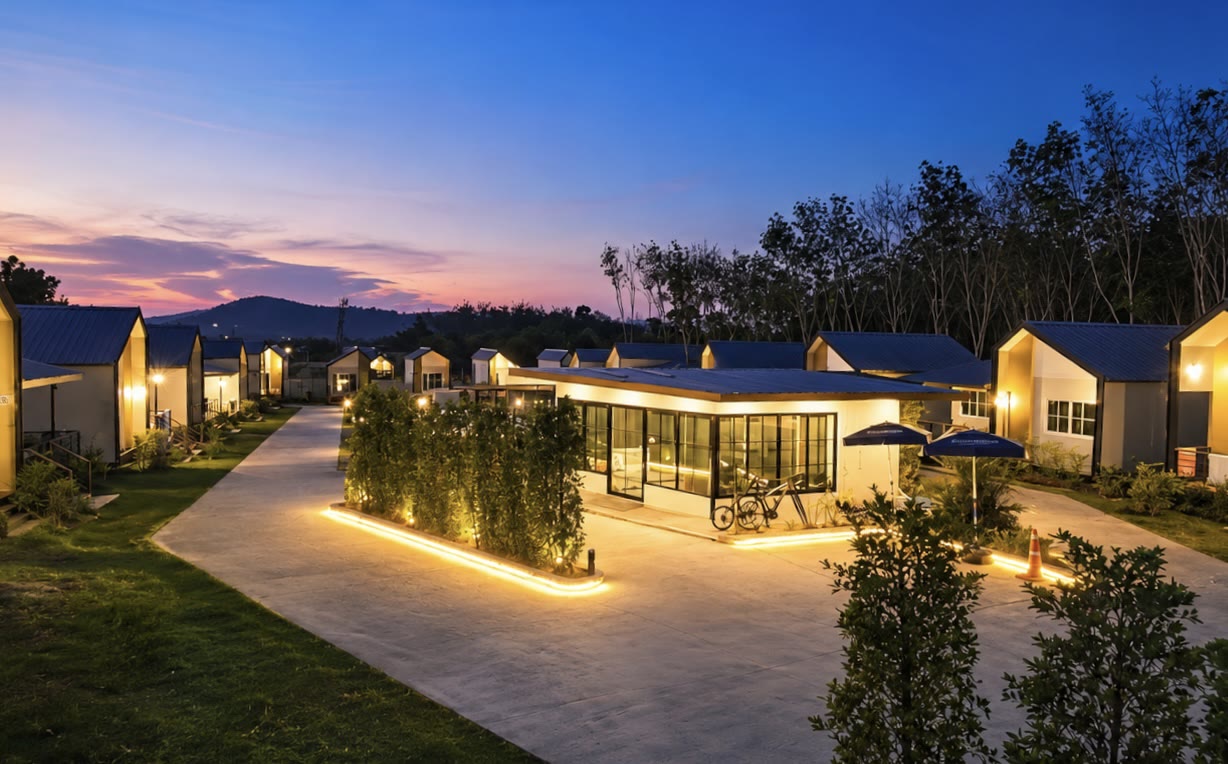 Resort cabins lit at dusk at NaraRin Phuket