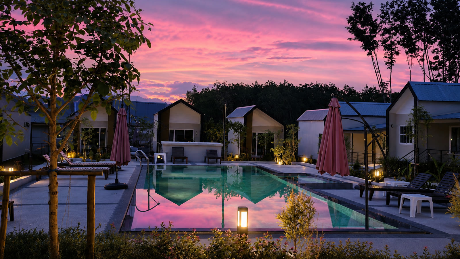 Resort and pool at pink dusk at NaraRin Phuket