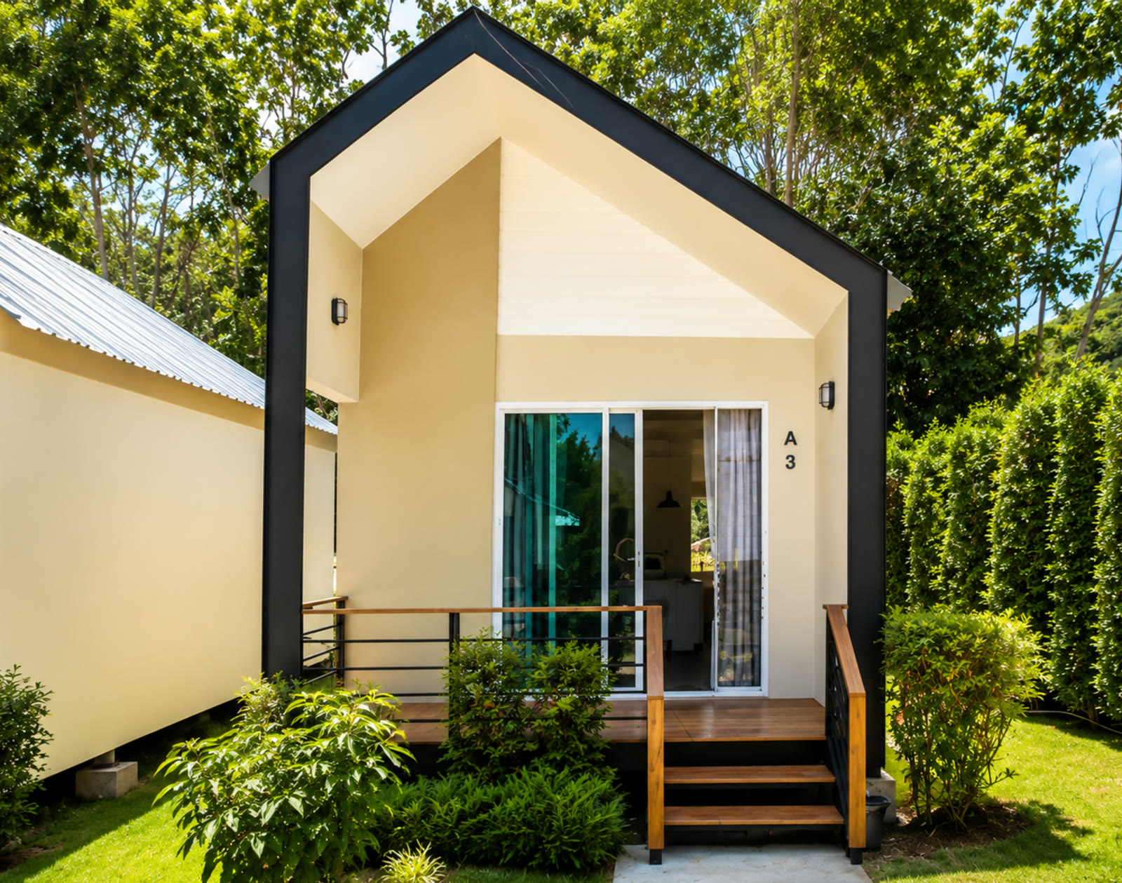 One-bedroom A-frame cabin at NaraRin Phuket in its garden setting