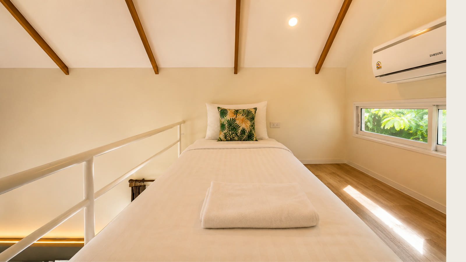 Mezzanine loft bed in the A-frame cabin at NaraRin Phuket