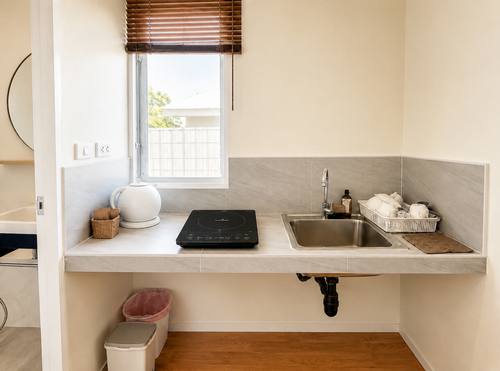 Kitchenette in the two-bedroom house at NaraRin Phuket with induction hob and sink